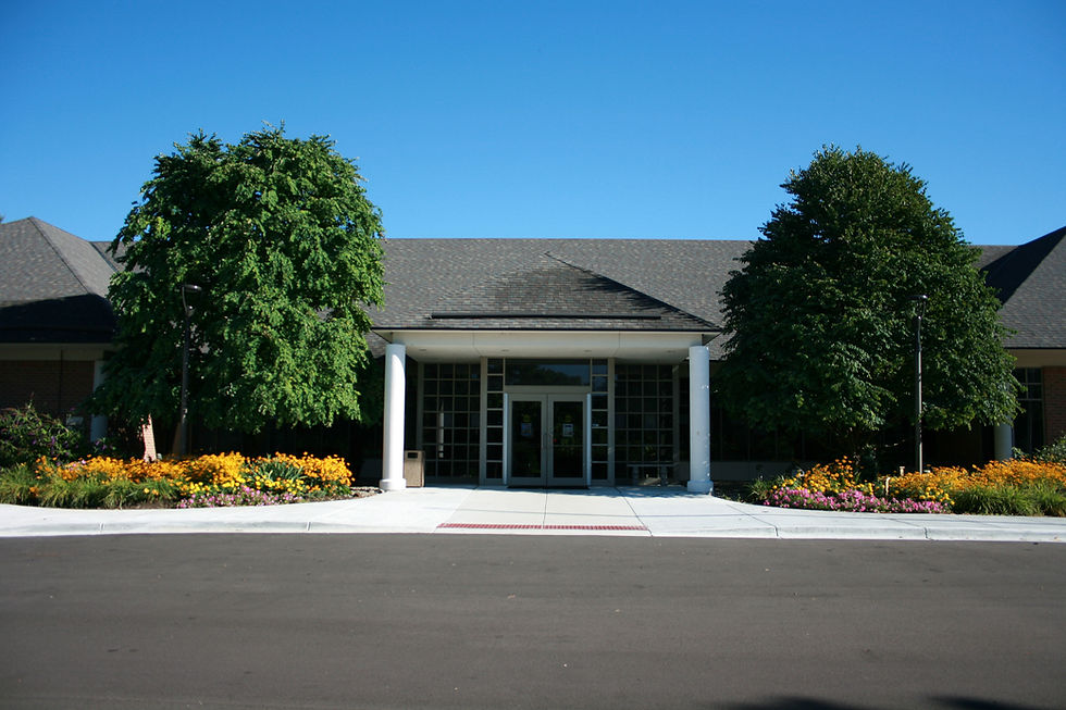 Image of the Clarkston Library front door in summer.